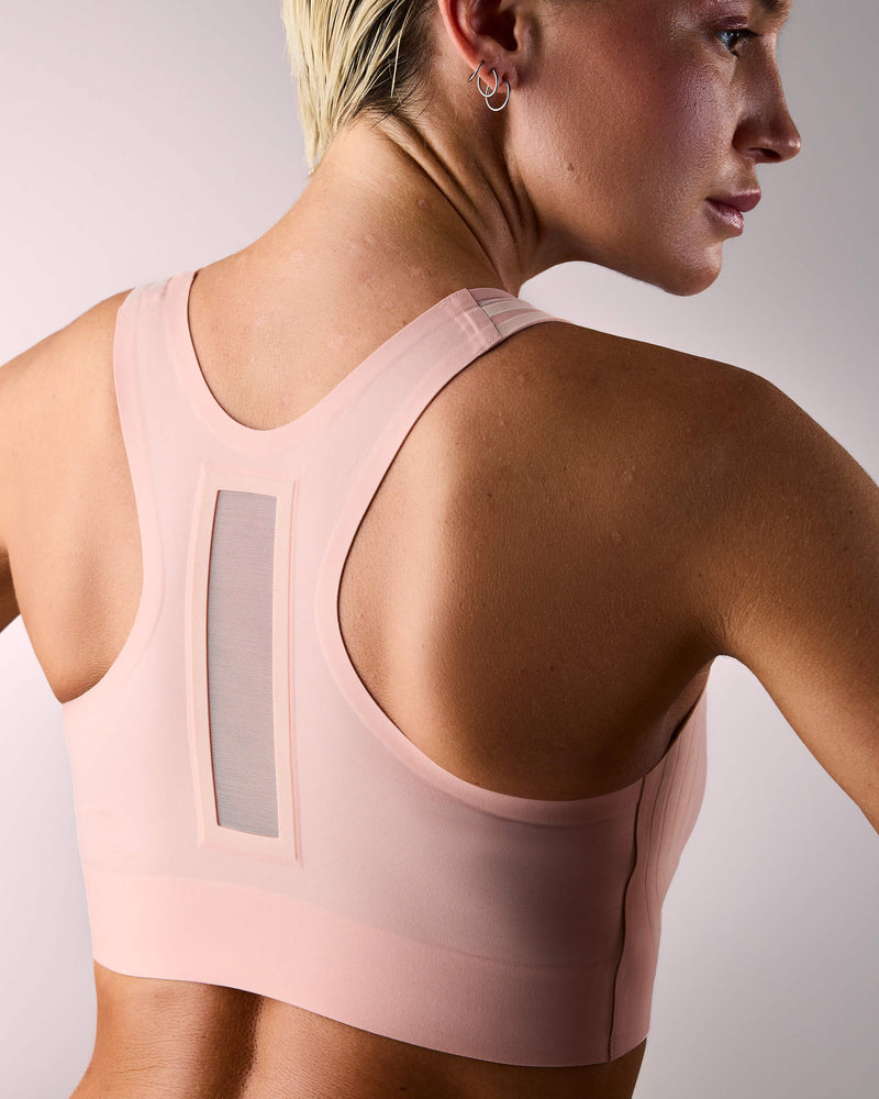 woman wearing a hastko BRA N°42 sports bra #color_nude