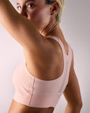 woman wearing a hastko BRA N°42 sports bra #color_nude