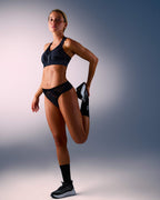 woman wearing a hastko seamless sports tanga TANGA N°23 #color_true-black