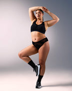 woman wearing a hastko seamless sports tanga TANGA N°23 #color_true-black