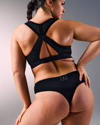 woman wearing a hastko seamless sports tanga TANGA N°23 #color_true-black
