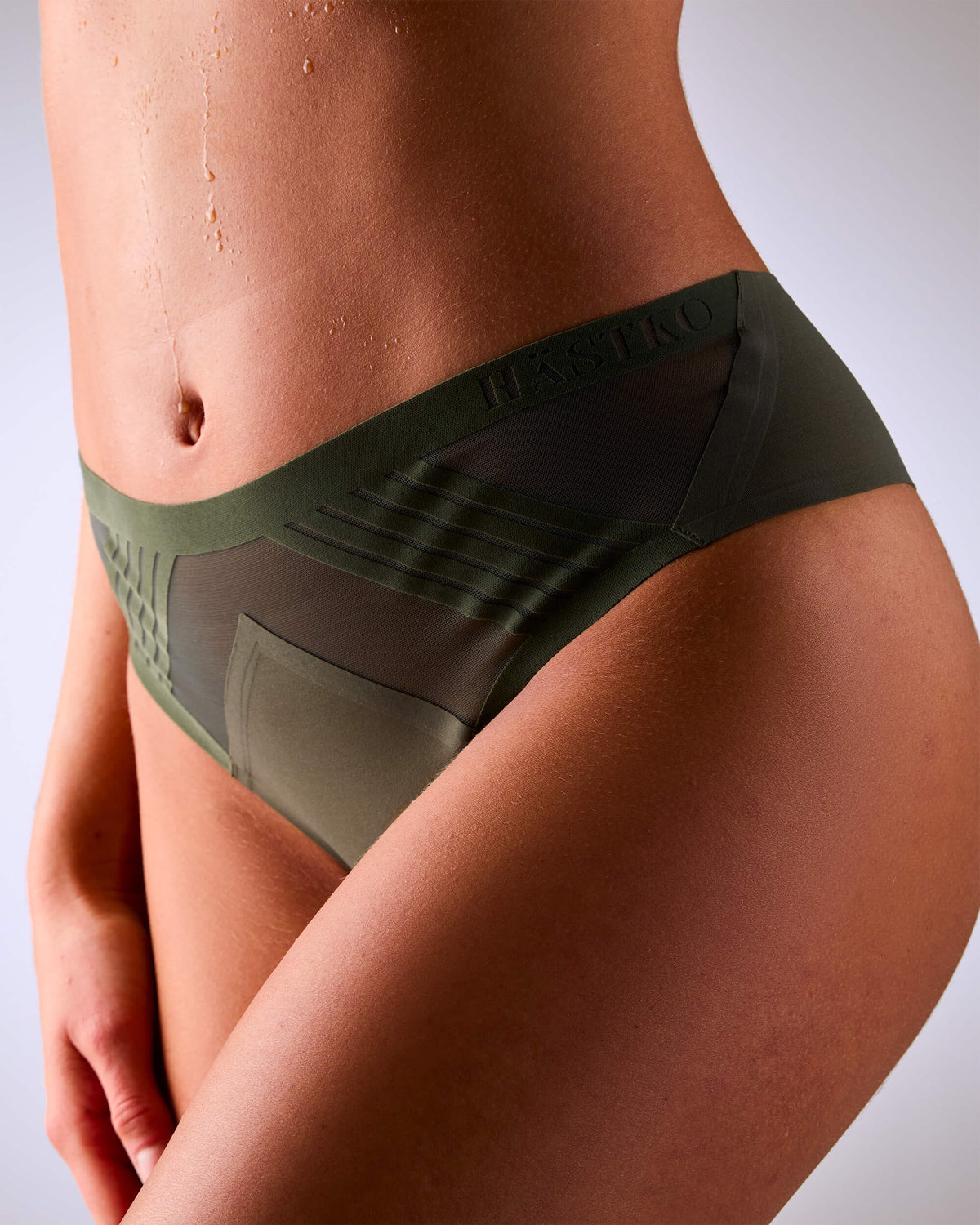 woman wearing a hastko seamless sports tanga TANGA N°23 #color_kaki