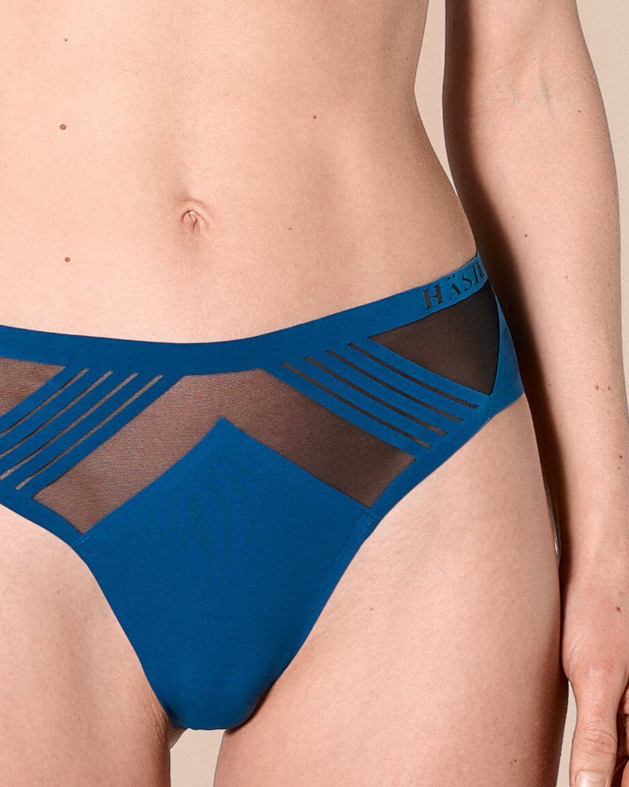 woman wearing a hastko seamless sports tanga TANGA N°23 #color_tropico-blue