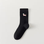Pack de 3 calcetines altos de canalé. Colores negro, gris jaspeado, blanco. Pequeño perro bordado en la parte exterior del pie. 