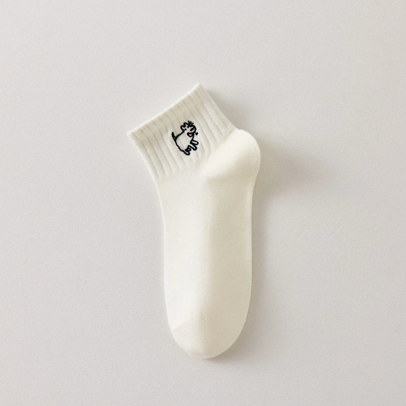 Lot de 3 chaussettes femme noir et blanc avec broderies chien. Motifs graphiques, maille douce et taille 35-41. Style original et confort assuré.