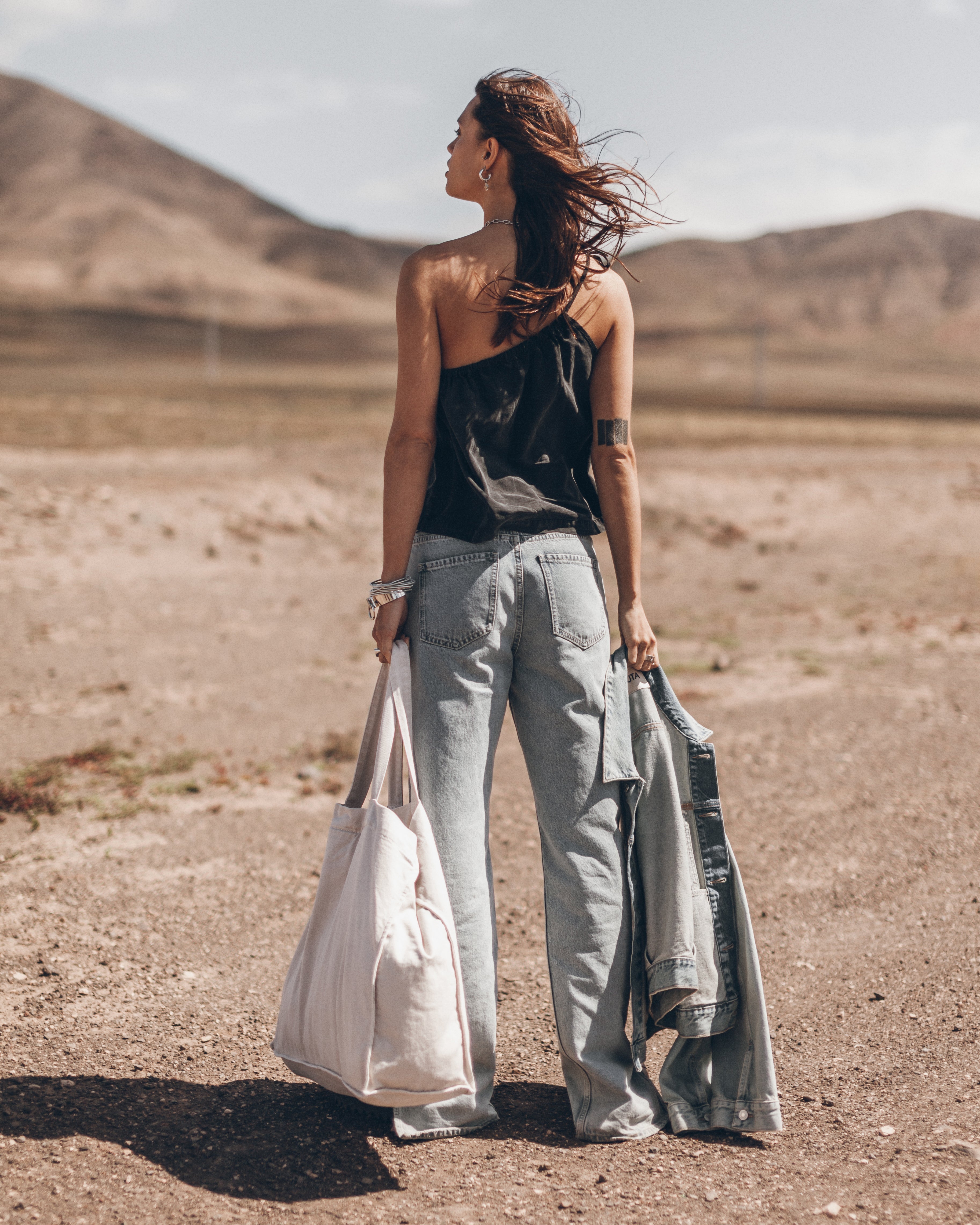 The Black Asymmetrical Top The Blue Straight Slit Jeans The Me Necklace The Light Large Canvas Ba...
