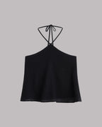 Black halter top on a gray background