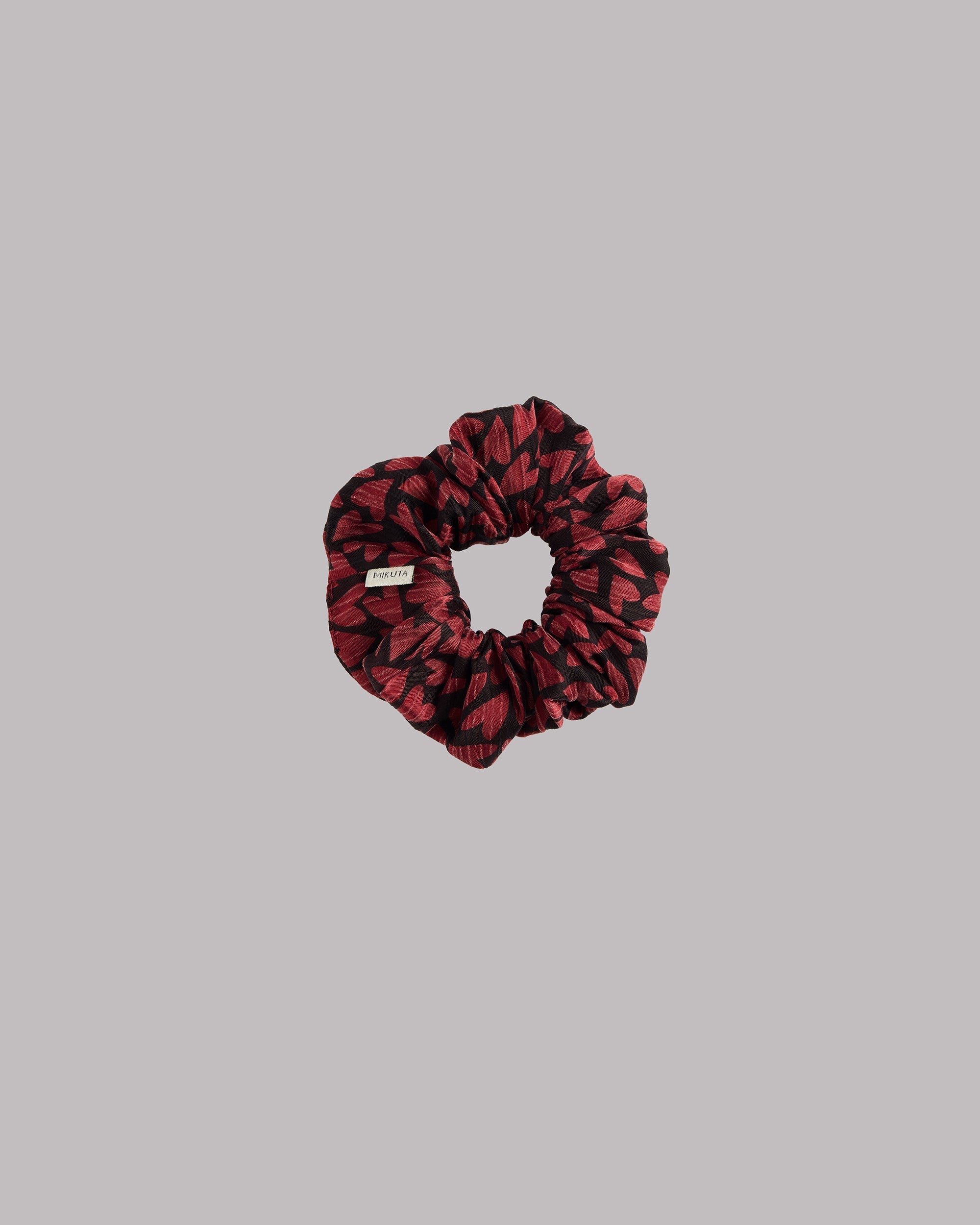 Red hearts scrunchie product shot - romantic Valentine's accessory