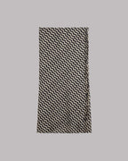 Black and white striped skirt on a gray background