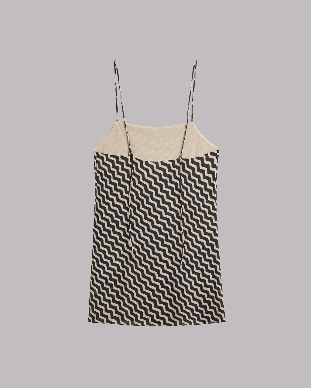 Sleeveless dress with Black and white zigzag pattern on a gray background