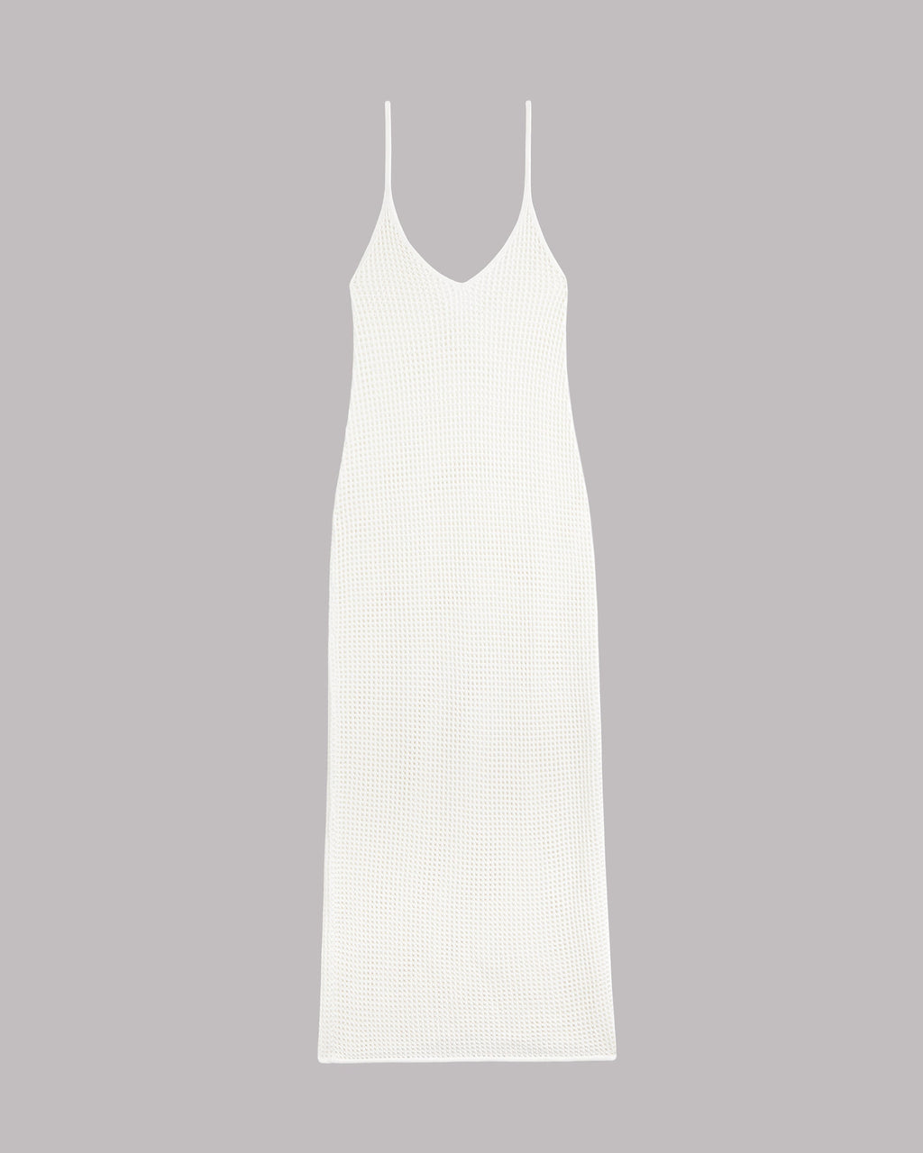 White slip knitted dress on a gray background