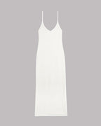 White slip knitted dress on a gray background