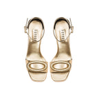 Naria Gold Platform Ankle Sandal with embroidered oval embellishment, crafted from golden Italian leather.