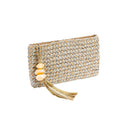 Perla Silver & Natural Clutch made of jute and metallic thread with decorative tassel and shells.