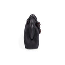Side view of the Petra Black Pouch Bag, made of suede leather with stone embroidery, featuring a leather lining.