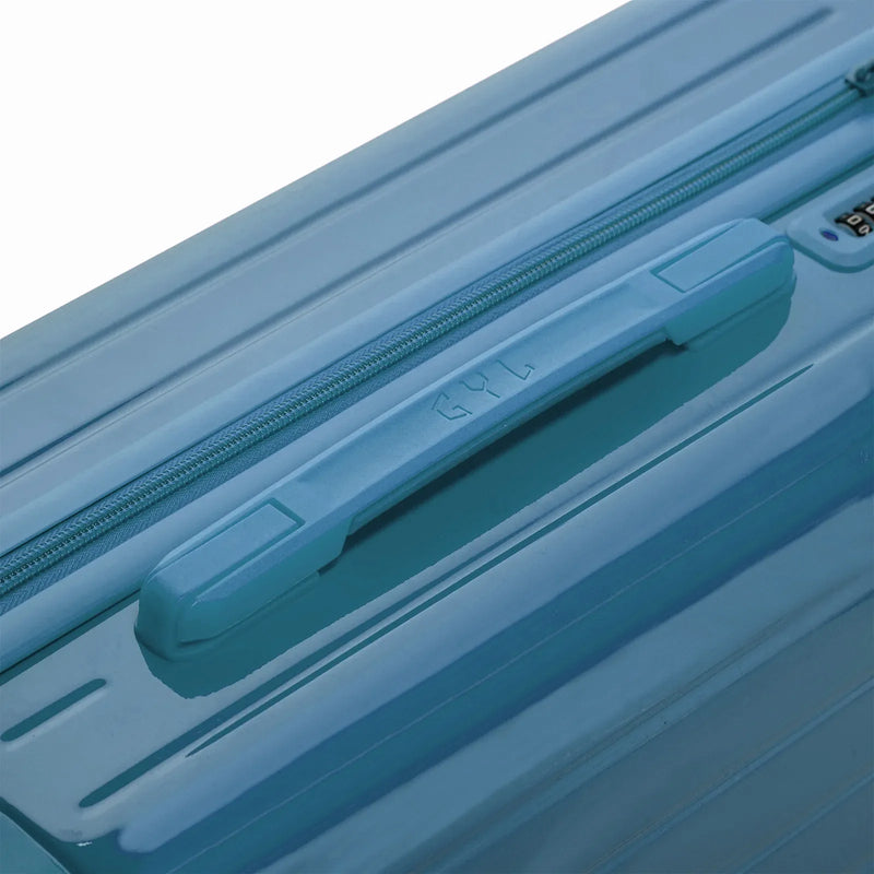 Asa superior rígida de la maleta GYL Intemporelle azul gris con logo grabado en la parte superior. #color_gris_azul