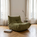Sillón Togo de terciopelo verde acanalado