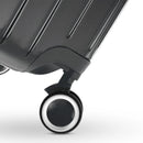 Roue double 360° de la valise GYL Intemporelle gris foncé avec gravure du logo GYL sur le moyeu. #couleur_gris foncé