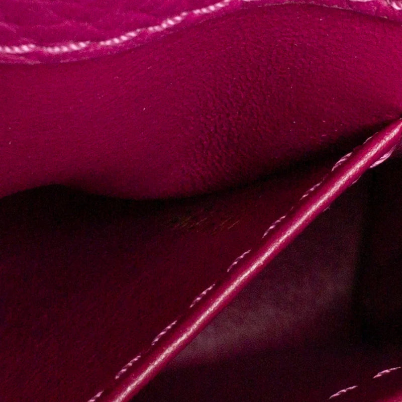 sac de seconde main capucines  louis vuitton  en cuir violet numéro de série