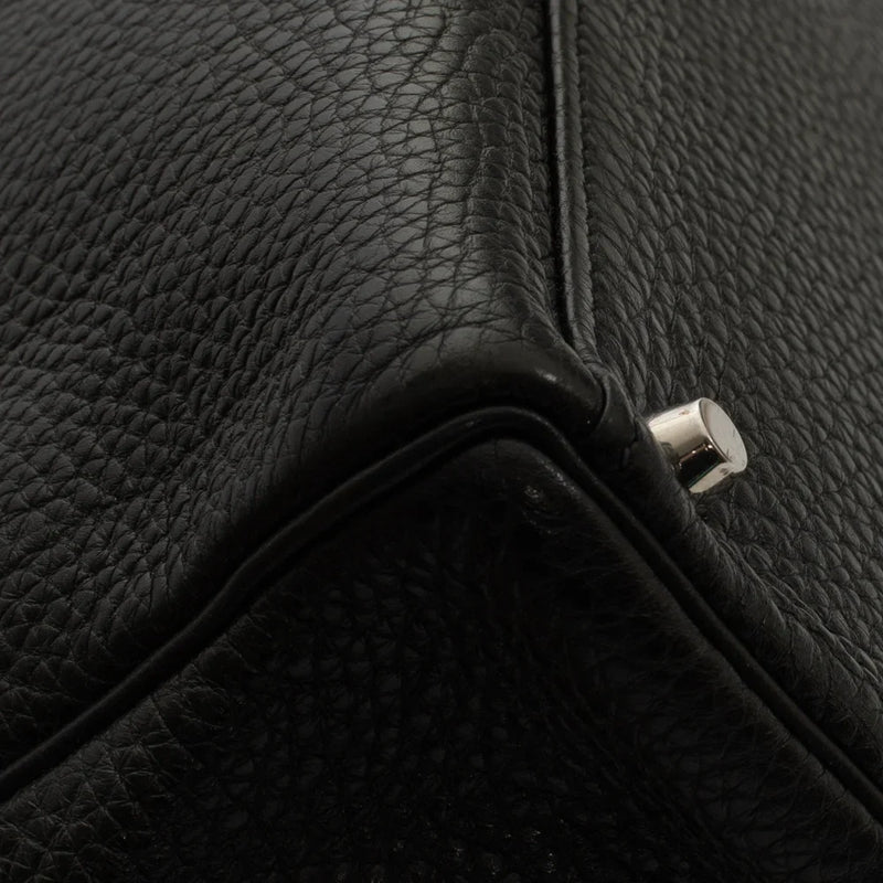 sac de seconde main kelly  hermès en cuir noir coin