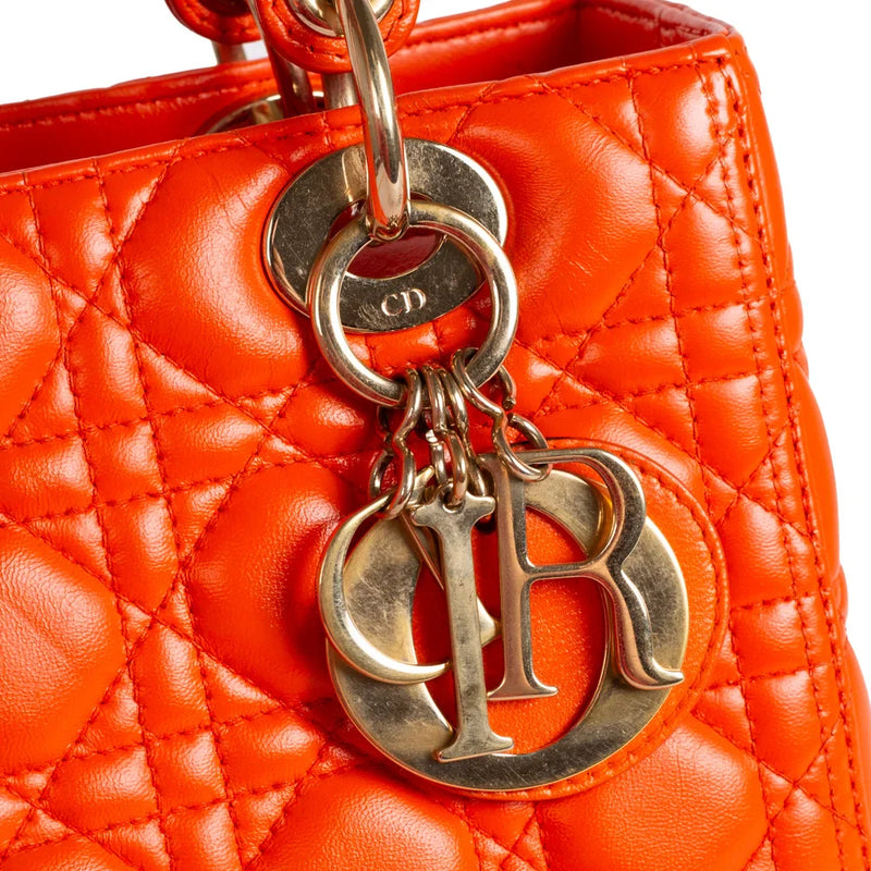 sac de seconde main lady dior   en cuir orange  défaut 1