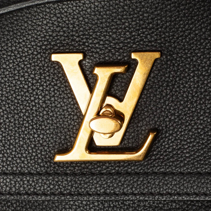 sac de seconde main lock me  louis vuitton en cuir noir défaut 1