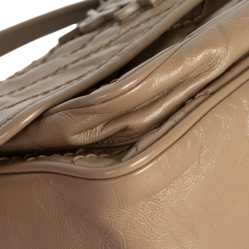 sac de seconde main niki saint laurent en cuir beige coin