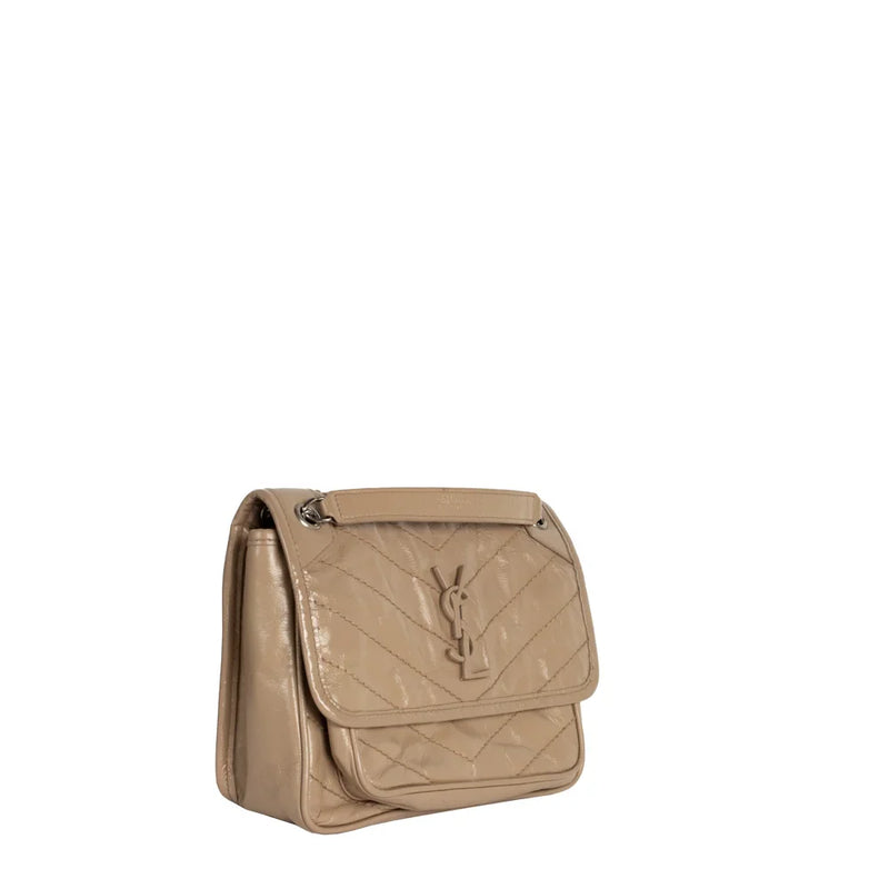 sac de seconde main niki saint laurent en cuir beige côté