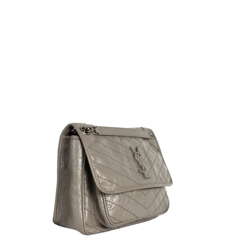 sac de seconde main niki  saint laurent  en cuir gris côté