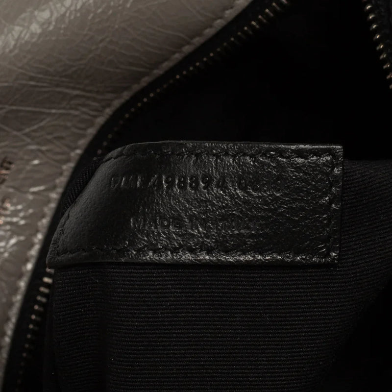 sac de seconde main niki  saint laurent  en cuir gris numéro de série 