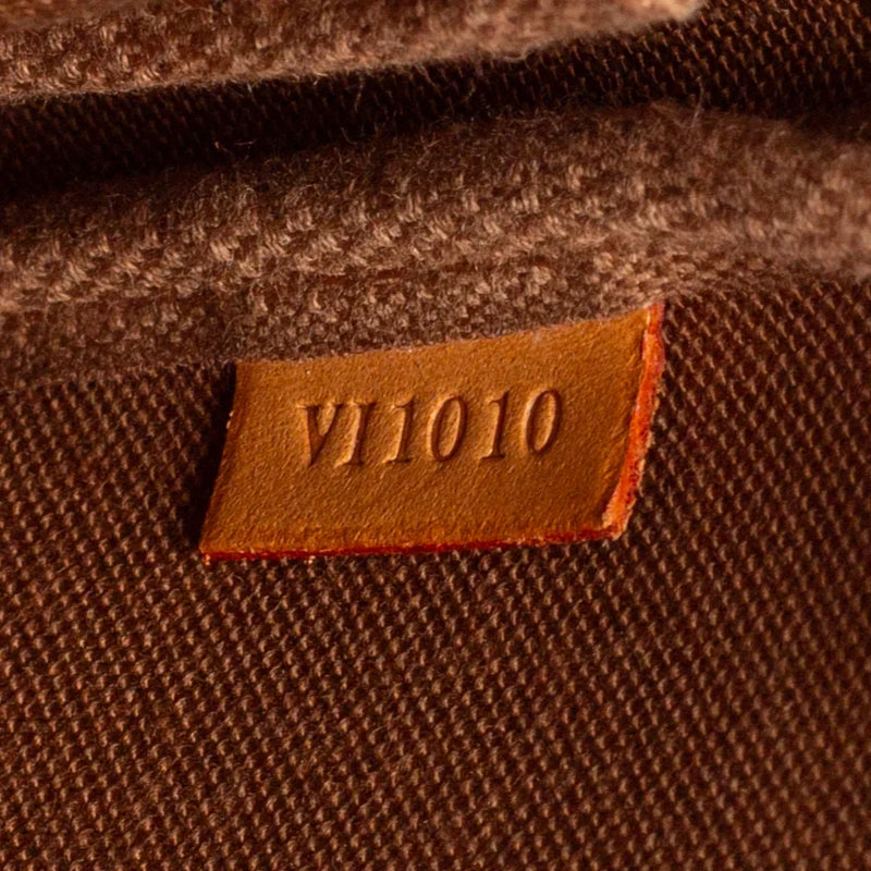 sac de seconde main pochette accessoires louis vuitton en toile monogram marron numéro de série