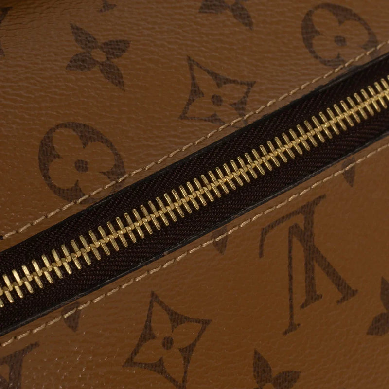 sac de seconde main pochette métis  louis vuitton  en toile monogram marron défaut 2