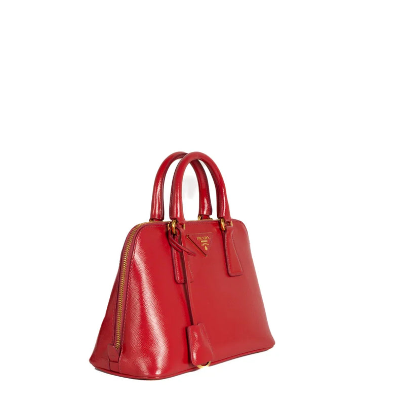 sac de seconde main promenade prada en cuir verni rouge côté