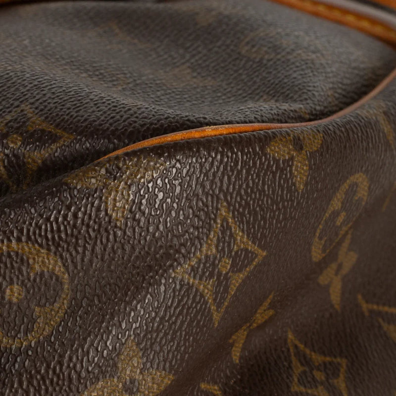 sac de seconde main saumur louis vuitton en toile monogram marron coin