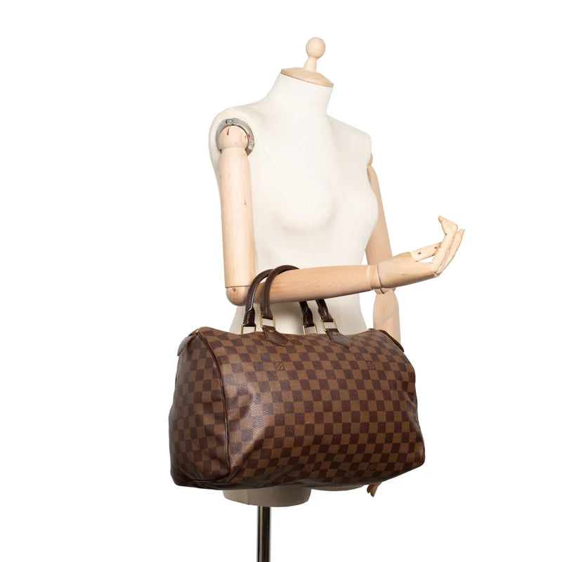 sac de seconde main speedy louis vuitton en toile damier ébène porté 1