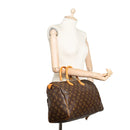 sac de seconde main speedy louis vuitton en toile monogram marron porté 1