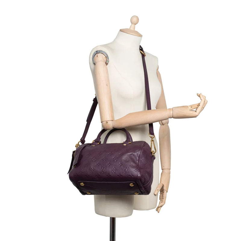 sac de seconde main speedy louis vuitton en cuir empreinte violet porté 1