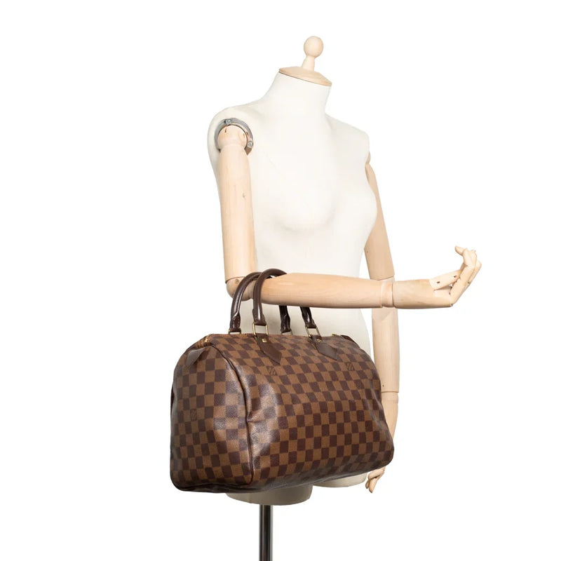 sac de seconde main speedy louis vuitton en toile damier ébène porté 1