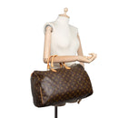 sac de seconde main speedy louis vuitton en toile monogram marron porté 1