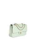 sac de seconde main timeless chanel  en cuir vert côté