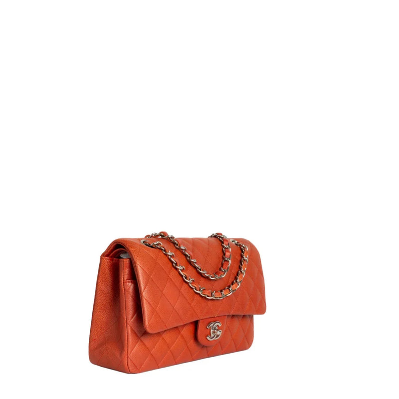 sac de seconde main timeless chanel  en cuir orange côté