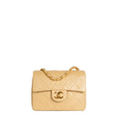 sac de seconde main timeless chanel  en cuir beige  face