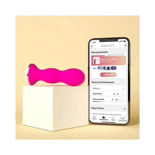 Sonde périnéale rose de Perifit pour muscler périnée à côté d'un téléphone connecté sur l'application