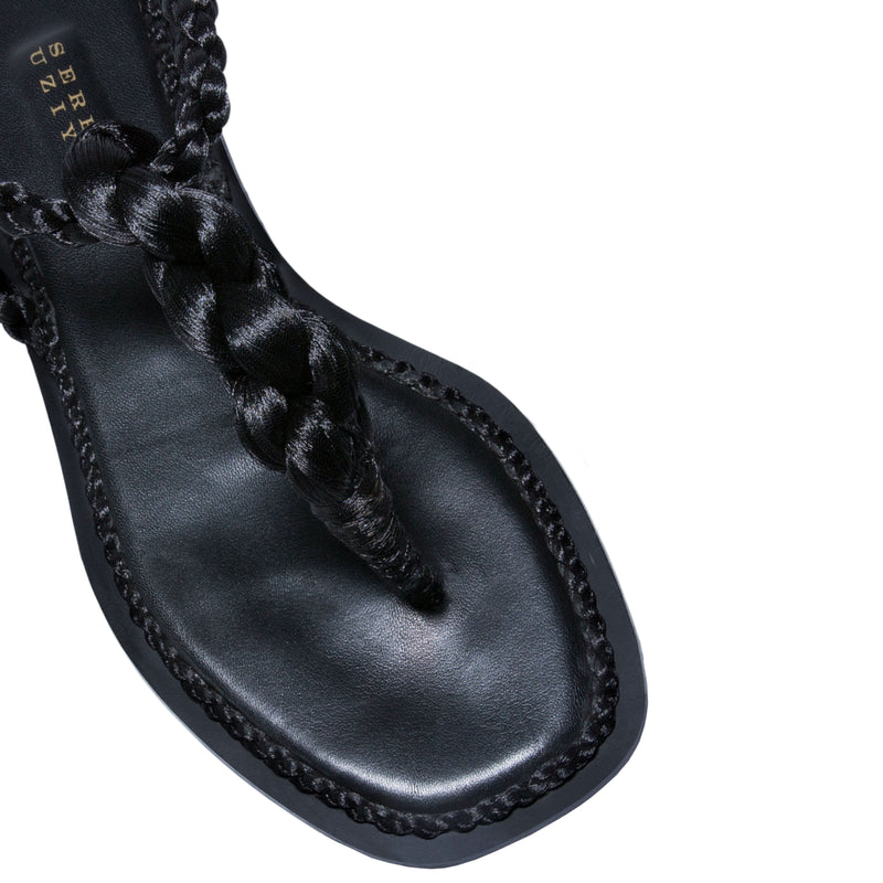 Thory black flat sandal featuring elegant braided metallic thread design and soft Italian leather sole.