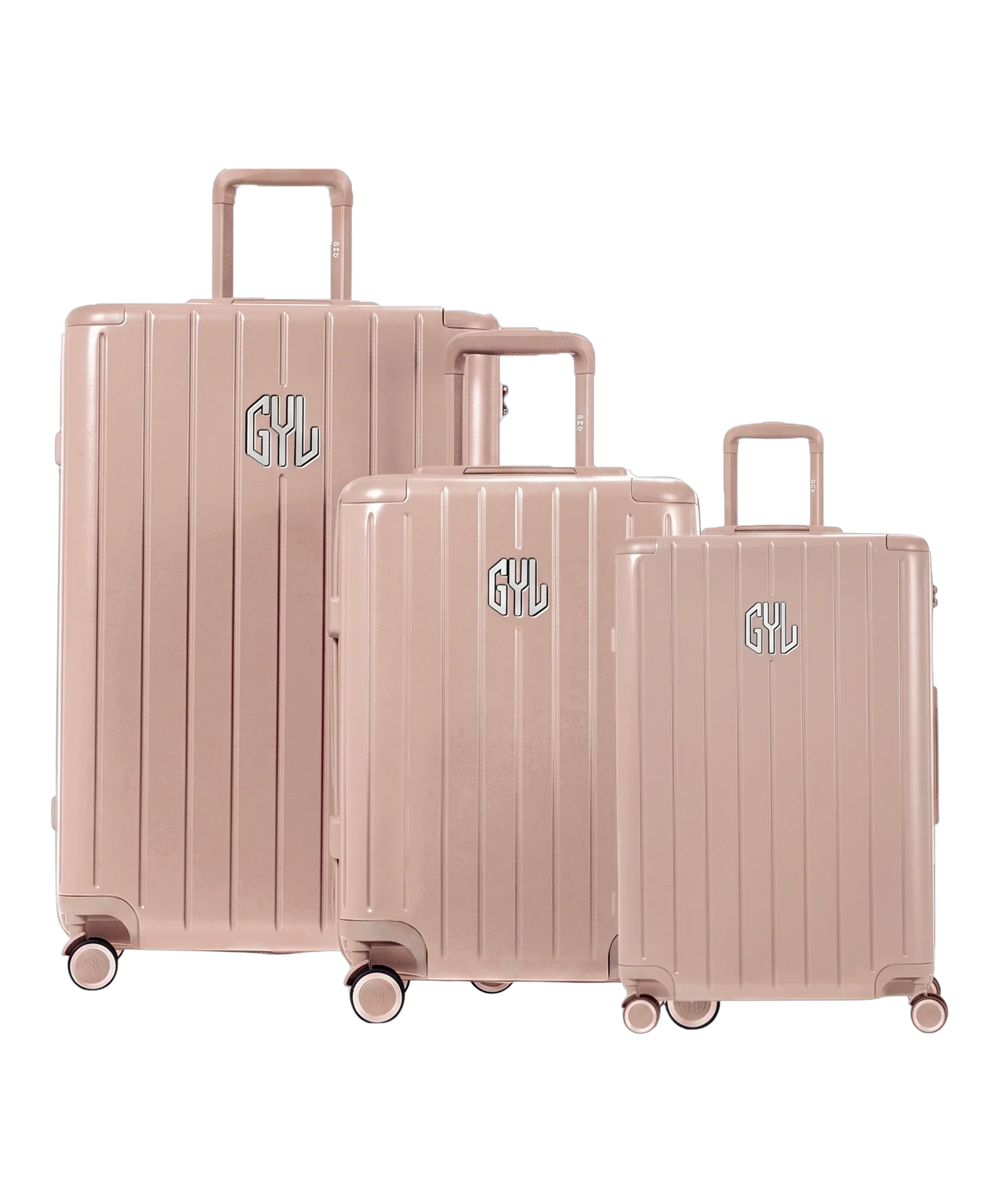 Trio de valises rigides GYL Intemporelle nude avec coques nervurées et poignées télescopiques. #couleur_nude