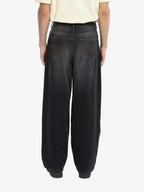 Le Pantalon Baggy En Denim Noir Délavé