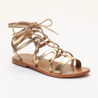 Sandalias planas Crescent en dorado oscuro