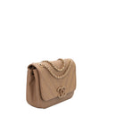 sac de seconde main cuba chanel en cuir beige  côté