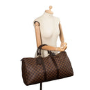 sac de seconde main keepall  louis vuitton en toile damier ébène porté 1