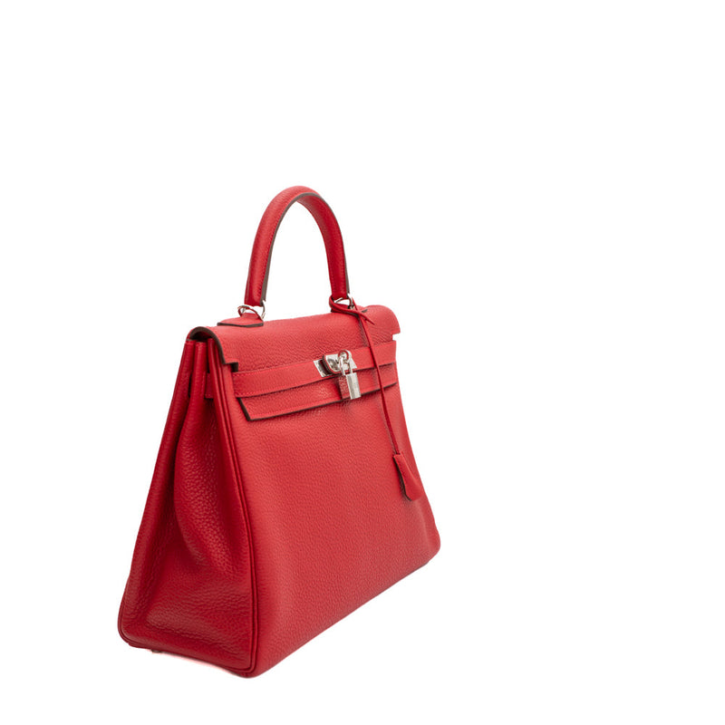 sac de seconde main kelly hermès  en cuir rouge  côté